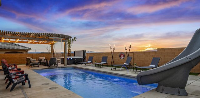 Private pool with slide and pergola at sunset at Paseos 1373