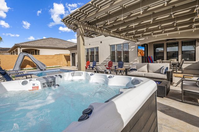 Private hot tub under pergola beside patio at Paseos 1373