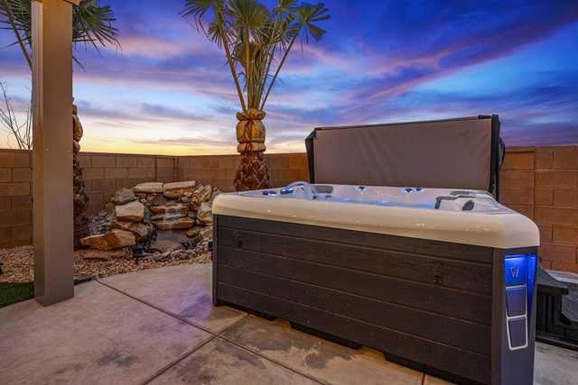 Private hot tub with rock water feature at Paseos 1373