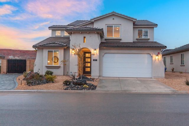 Front exterior of the two-story home with two-car garage
