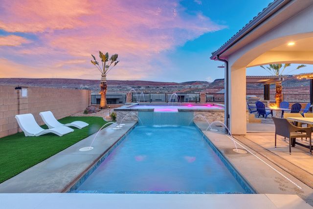 Private pool with lounge chairs, turf and covered patio