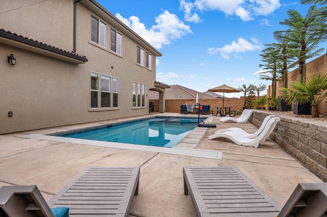 Private pool with sun loungers in the walled yard