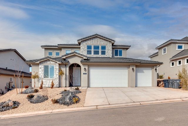 Front exterior of Paseos 1433 with stone accents and garages