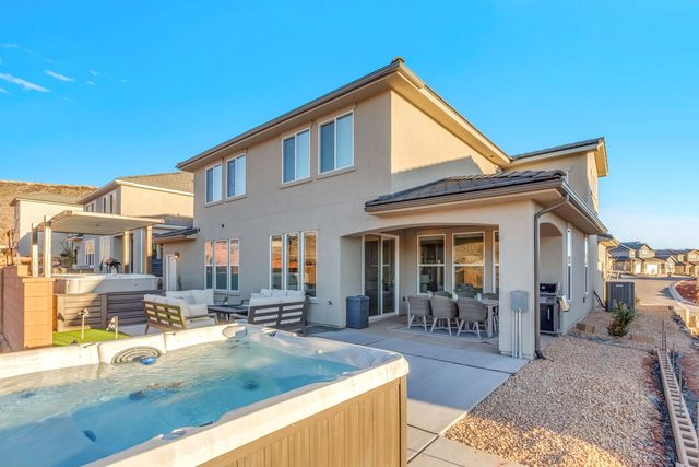 Rear exterior of Paseos 1433 with swim spa and patio