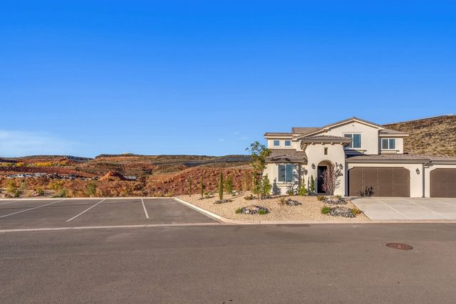 Front view of the home across the street parking area
