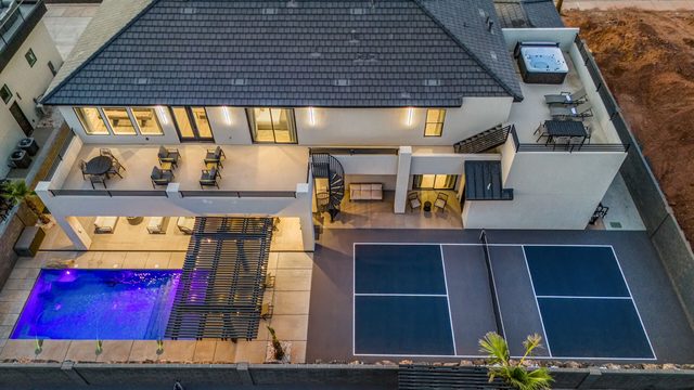 Aerial view of Pecan Valley 5161 backyard with pool and pickleball court