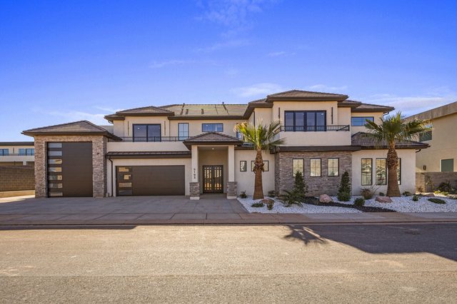 Two-story front exterior and three-car garage of Pecan Valley 5193