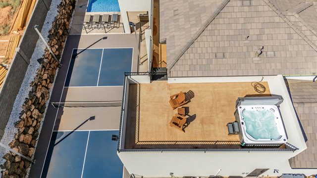 Aerial of roof deck hot tub and pickleball court at Pecan Valley 5193