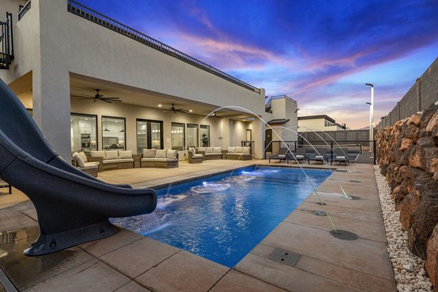 Private pool with water slide and covered patio at Pecan Valley 5193