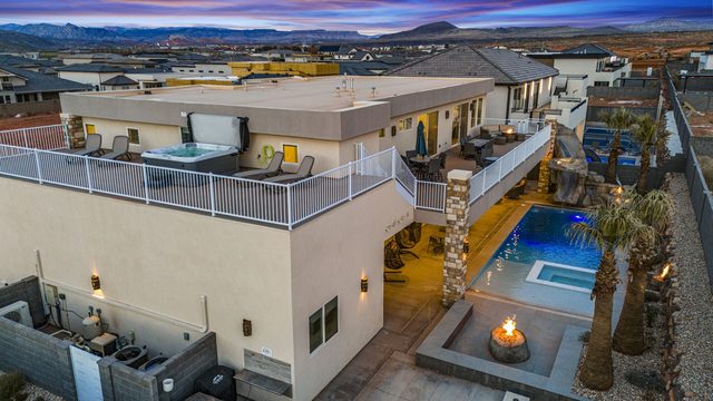 Aerial view of the 5205 home, pool, fire pit and rooftop hot tub