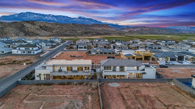 Aerial rear view of both homes with connecting backyards