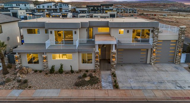Front exterior of the 5205 home with three-car garage