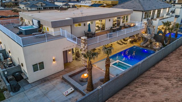 Aerial evening view of the home, pool and upper decks