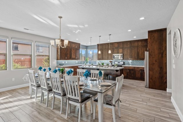 Unit 104 dining table for twelve beside the kitchen