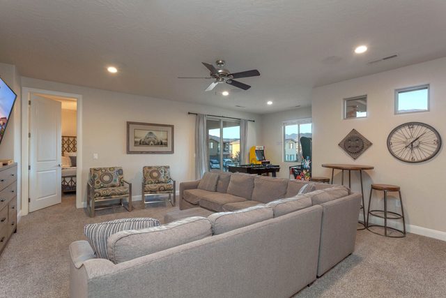 Unit 103 upstairs loft with sectional sofa and bar table