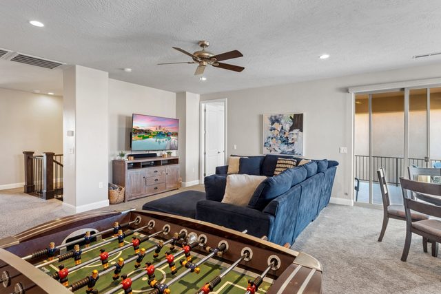 Unit 104 loft with foosball table, sectional and balcony