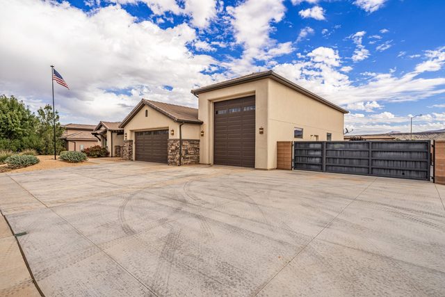 Front of Sand Hollow 2691 with RV garage and wide driveway