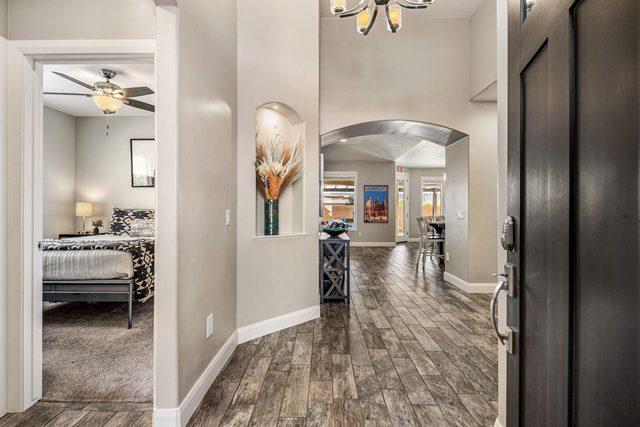 Entry hallway with view into a bedroom and living area