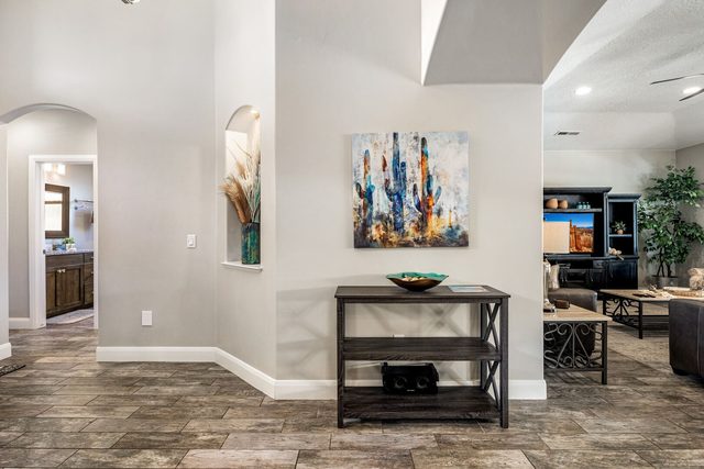 Entry hall console table leading to the family room
