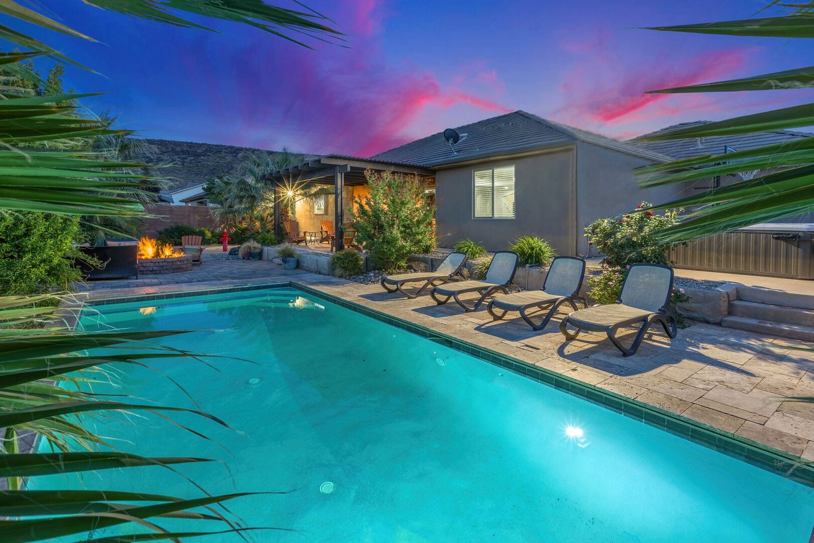Private pool with lounge chairs and home at sunset at Sand Hollow 3334