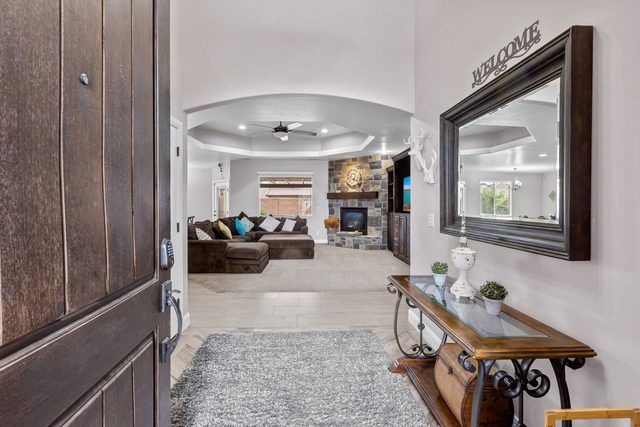 Front entry with welcome mirror looking into the living room