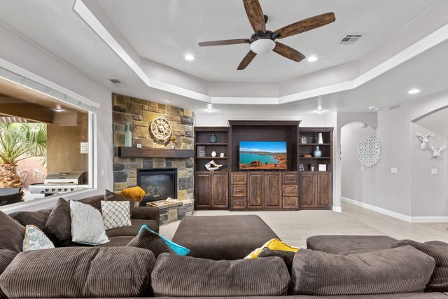 Oversized sectional in the living room with patio windows