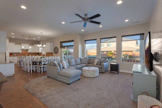 Open living room with sectional sofa and dining beyond at Sand Hollow 3370