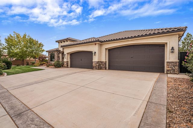 Wide driveway leading to the multi-car garage