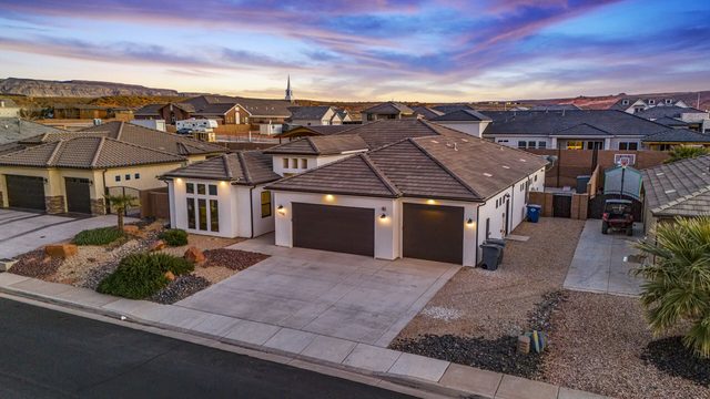 Street view of the single-level home at dusk at Sand Hollow 4301