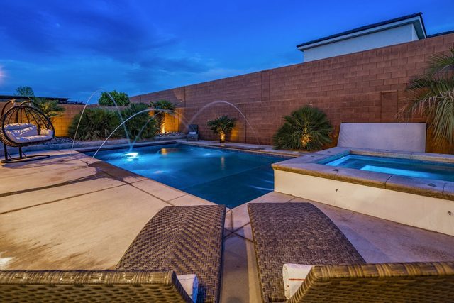Private pool and spa lit at twilight at Sand Hollow 4301