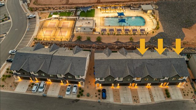 Night aerial of Skyline 1618/1622/1626 Retreat beside pickleball courts and pool