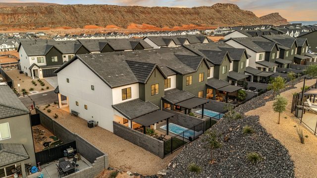 Aerial of Skyline Retreat homes with red cliffs beyond