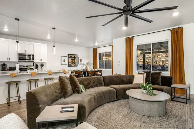Skyline 1618 living room with curved sectional open to the kitchen
