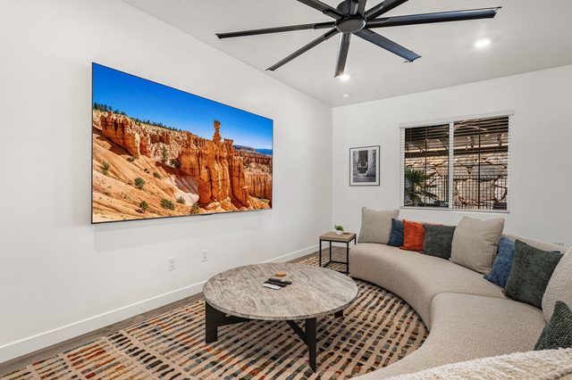 Living room sectional facing a large wall TV