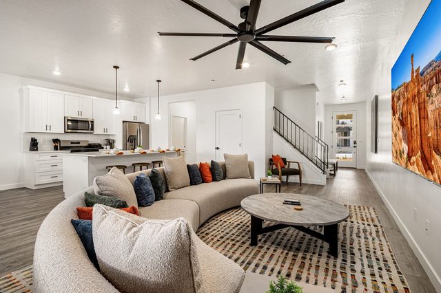 Open living area looking toward kitchen, stairs and entry at Skyline 1626