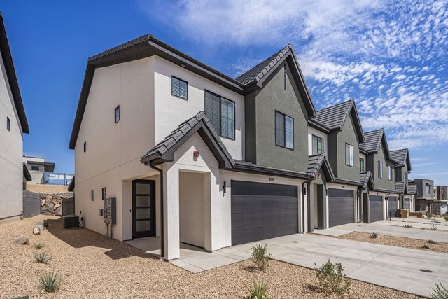 Two-story townhome exterior and garages at Skyline 1634