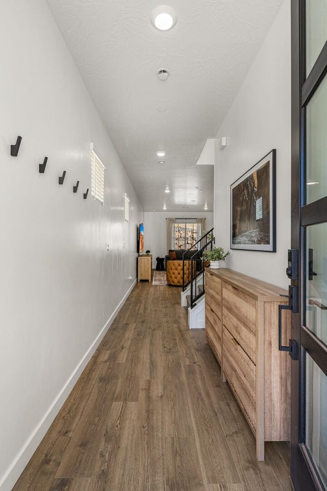 Front entry hallway with bench and wall hooks at Skyline 1634