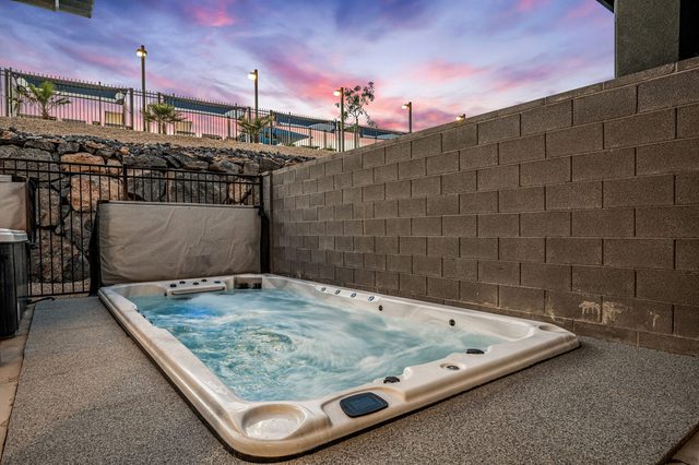 Year-round heated 16x9 swim spa in the backyard at Skyline 1634