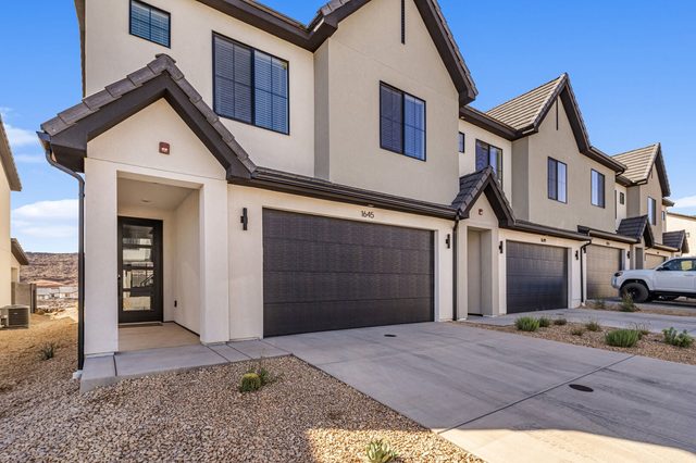 Front exterior and two-car garage of Skyline 1645 townhome