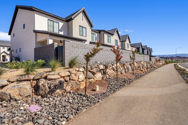 Row of Skyline Resort townhomes along a landscaped walking path