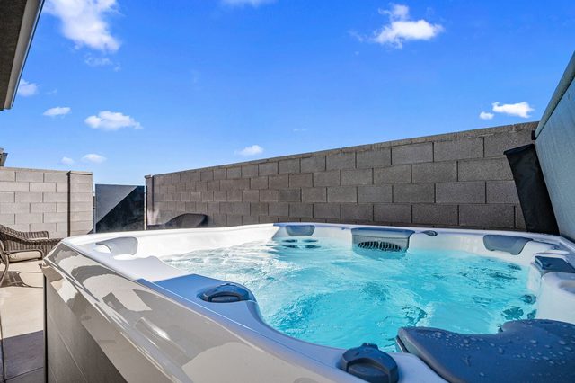 Private hot tub in the walled backyard