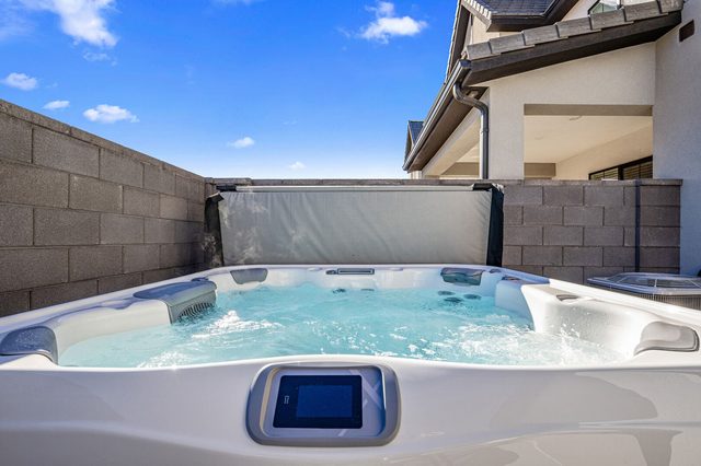 Private hot tub with control panel and privacy walls