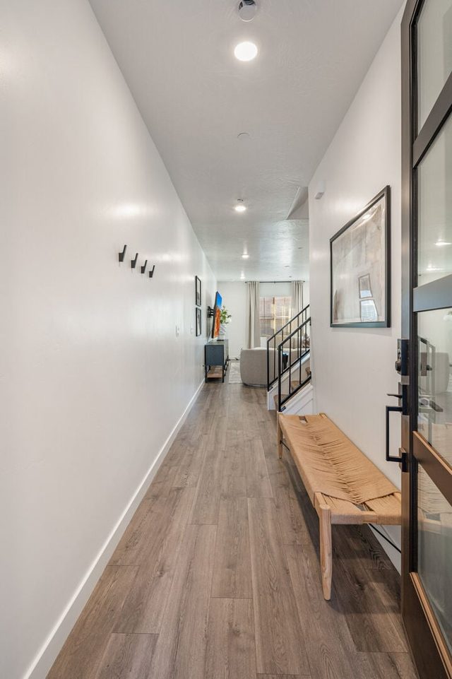 Front entry hallway with bench and wall hooks at Skyline 1649