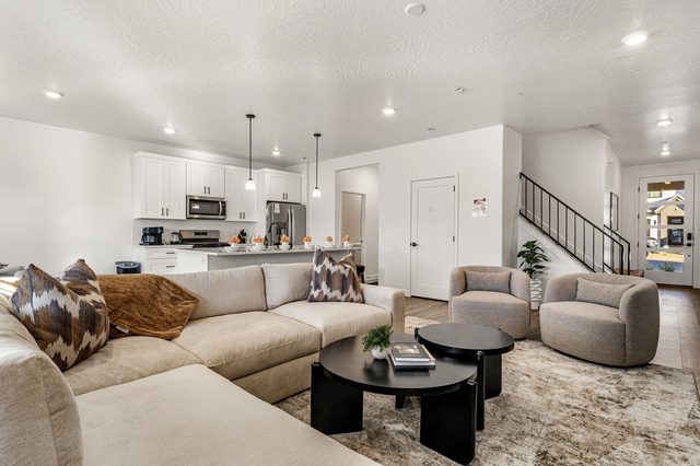 Living room looking toward the kitchen and entry at Skyline 1649