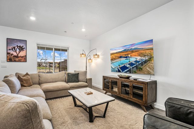 Sectional sofa facing a wall-mounted smart TV