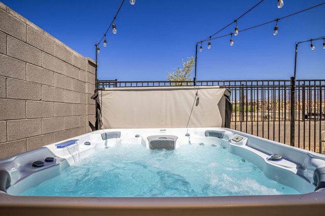 Private hot tub inside the fenced backyard of Skyline 1678