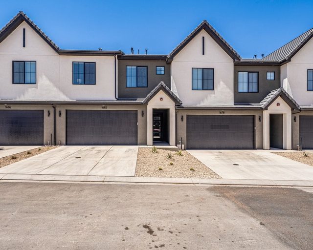 Front exterior of Skyline 1682 with attached garages and driveway