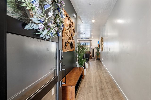 Entry hallway with wood console leading to the great room