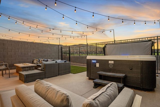 Private hot tub and fire pit lounge at sunset