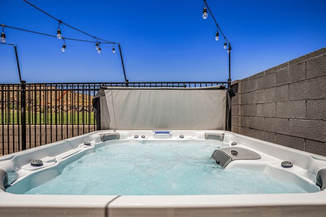 Private hot tub inside the fenced backyard